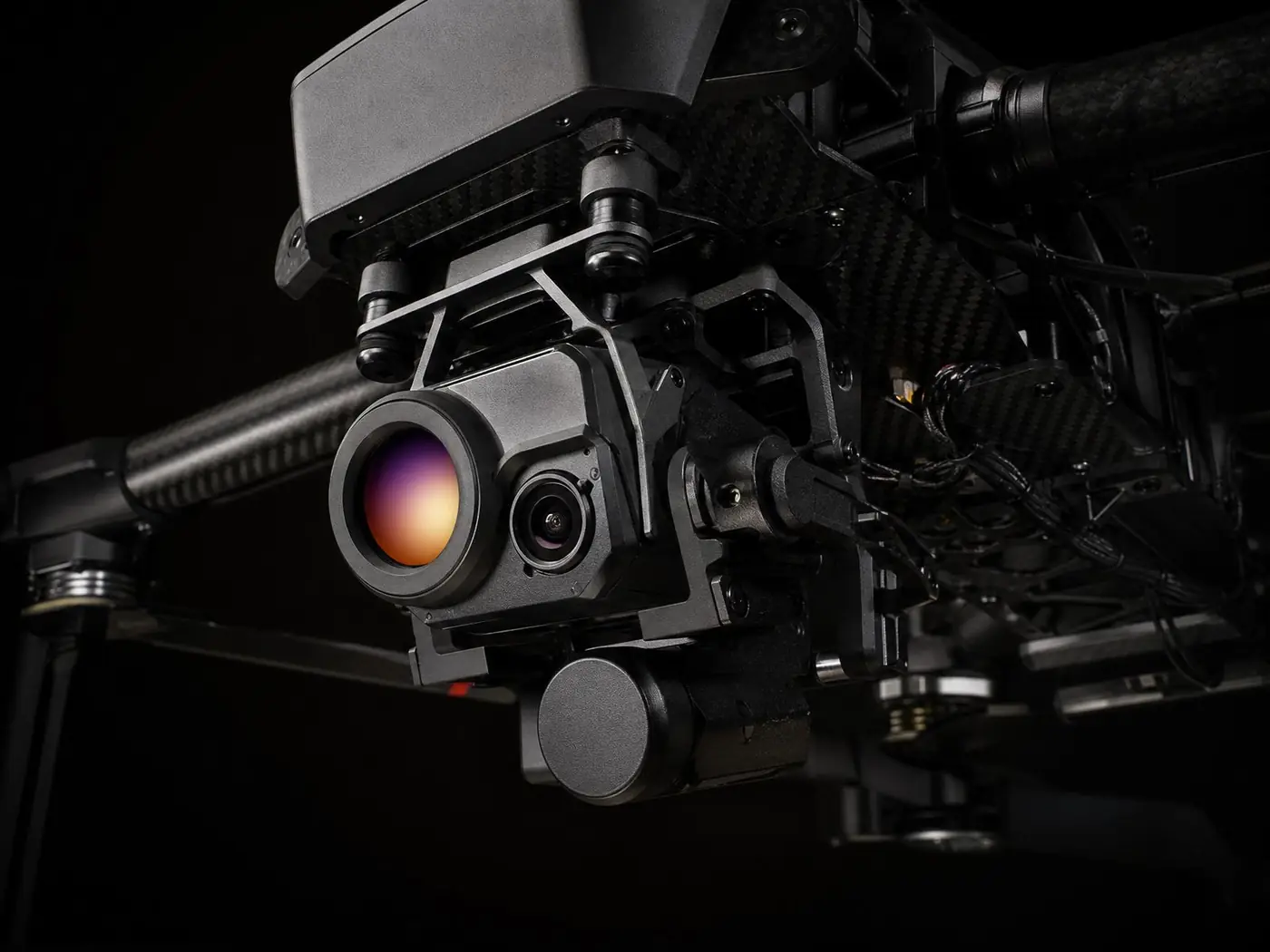 Underside detail: gimbal thermal camera, LiDAR, carbon-fibre chassis